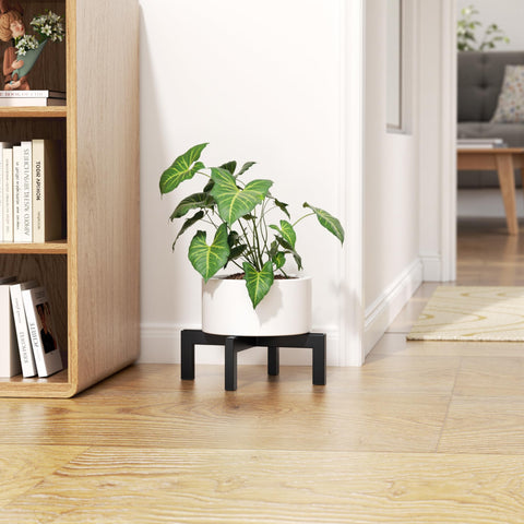 Bussdis plant stand features anti-slip pads for floor protection.