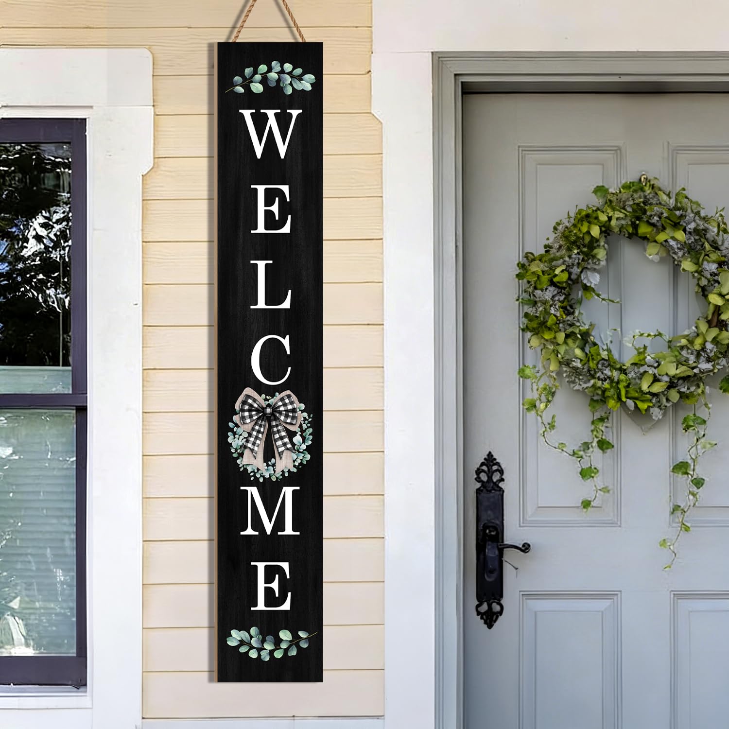 Buxjexh buffalo plaid bow detail on eucalyptus motif for festive farmhouse appeal.
