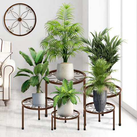 CADANI 5-pack metal plant stands for indoor and outdoor use, ideal for organizing pots.
