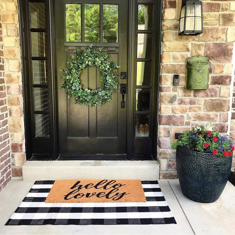 CAINANEL buffalo plaid outdoor rug closeup reveals woven texture and quality.