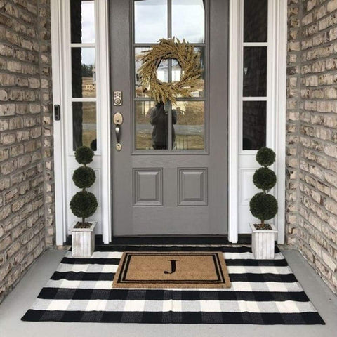 CAINANEL buffalo plaid outdoor rug suitable for indoor and outdoor use.