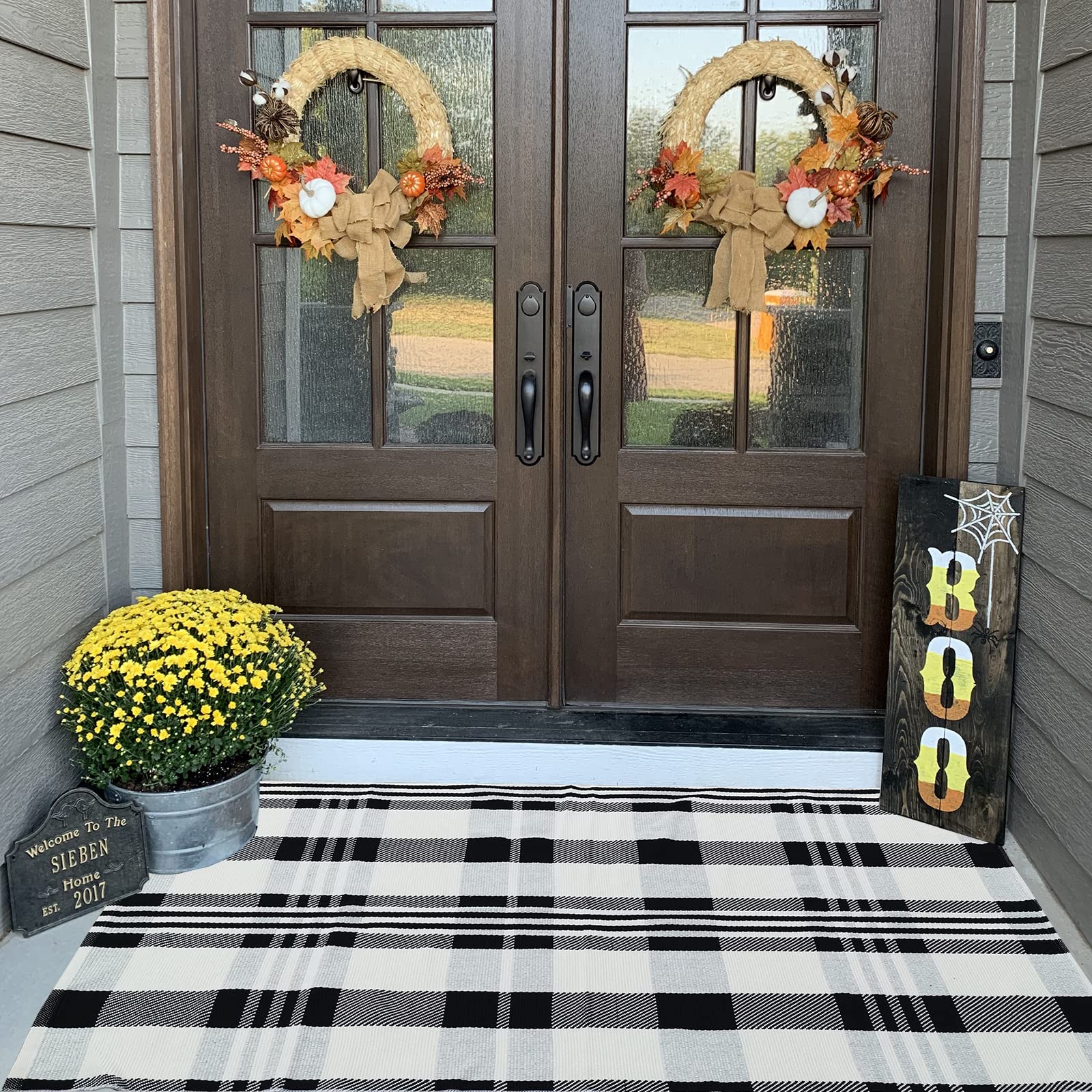 Layered porch look with CAINANEL buffalo plaid outdoor rug