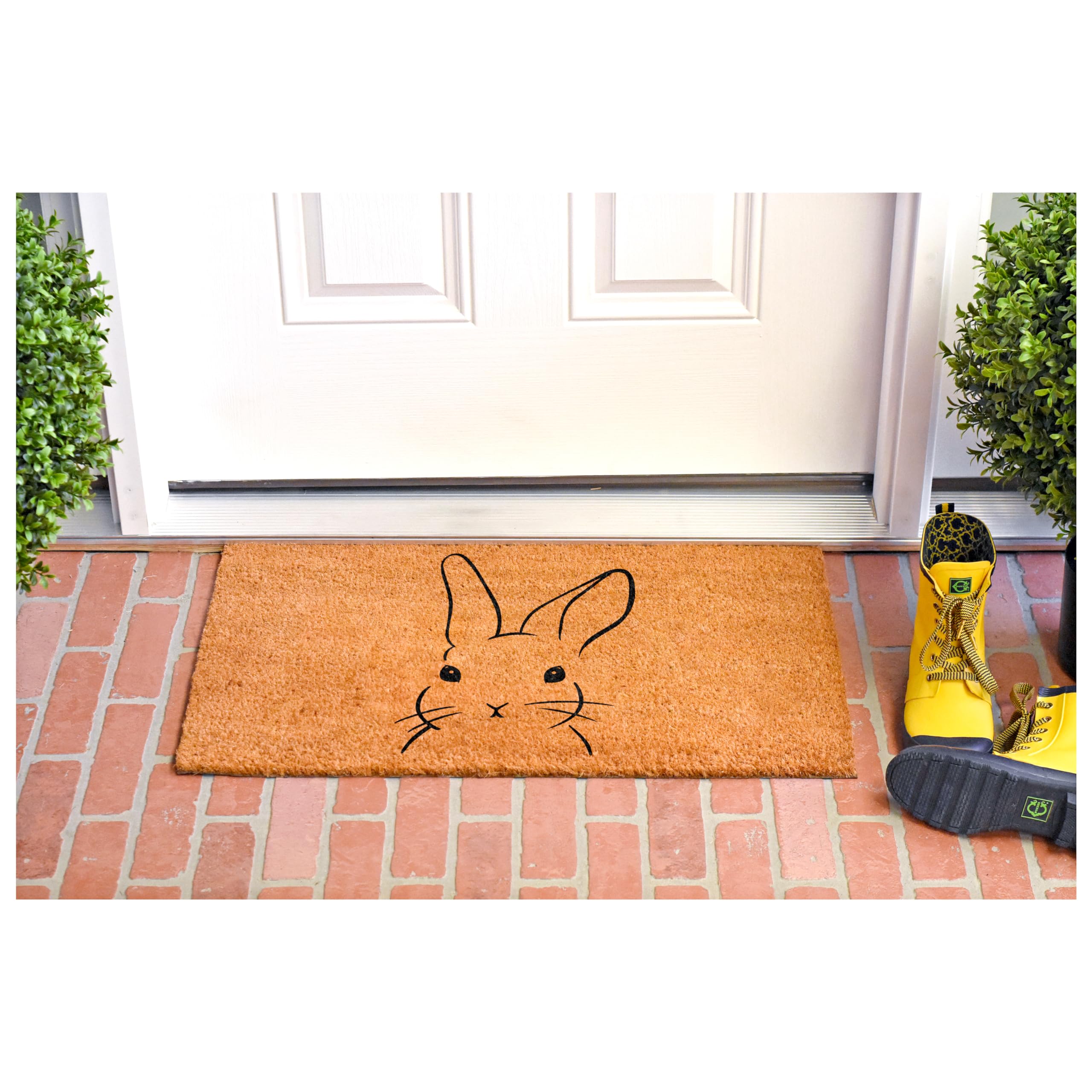 Calloway Mills Bunny Doormat placed on a sheltered porch for weather-ready entry.