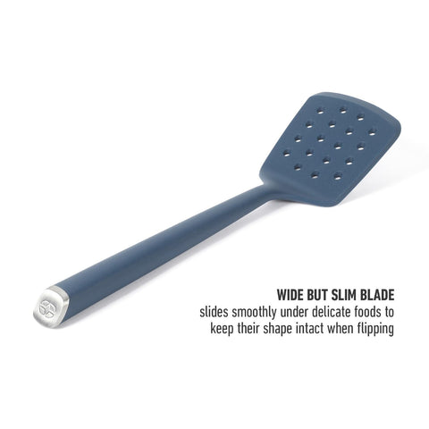 In-use shot of flipping eggs with Calphalon Edge silicone slotted turner