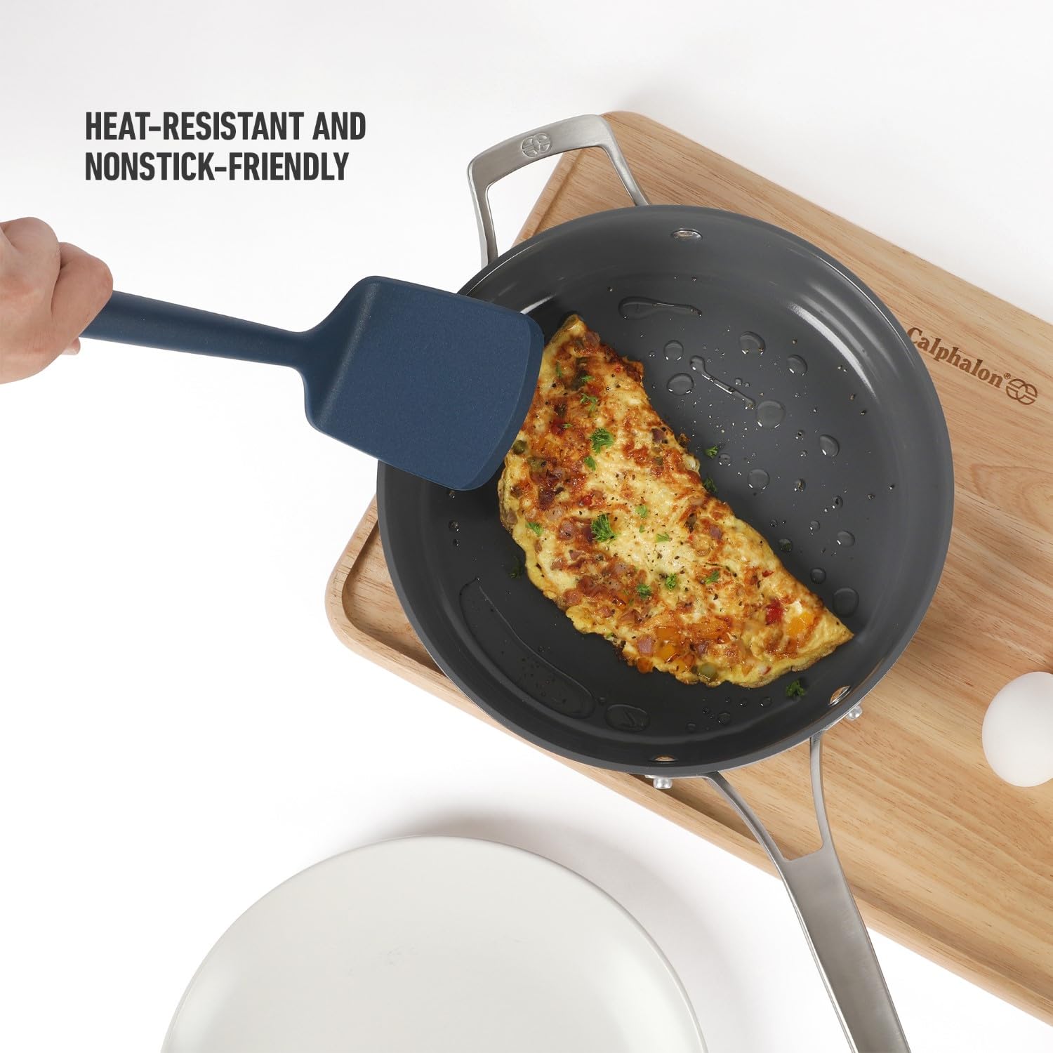 Calphalon Edge silicone turner with navy handle offers comfortable, non-slip grip.