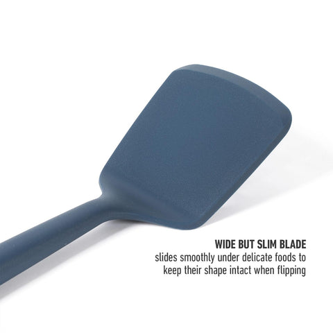 Calphalon Edge silicone turner in navy enables easy serving of pancakes and fish.