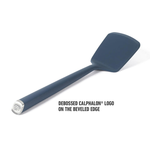 Calphalon Edge navy silicone turner supports quick flips of delicate foods like omelets.