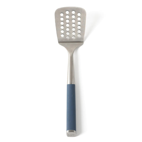 Calphalon Edge slotted turner in navy blue with perforations for draining liquids.