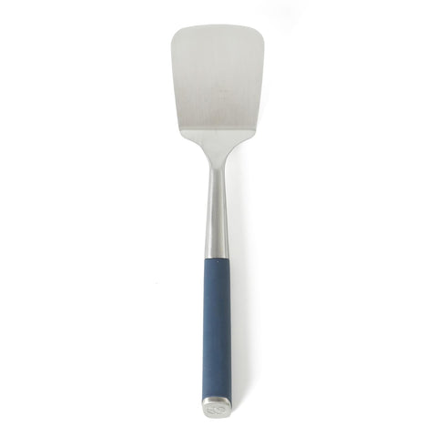 Calphalon Edge stainless steel turner with navy blue handle, versatile flipping