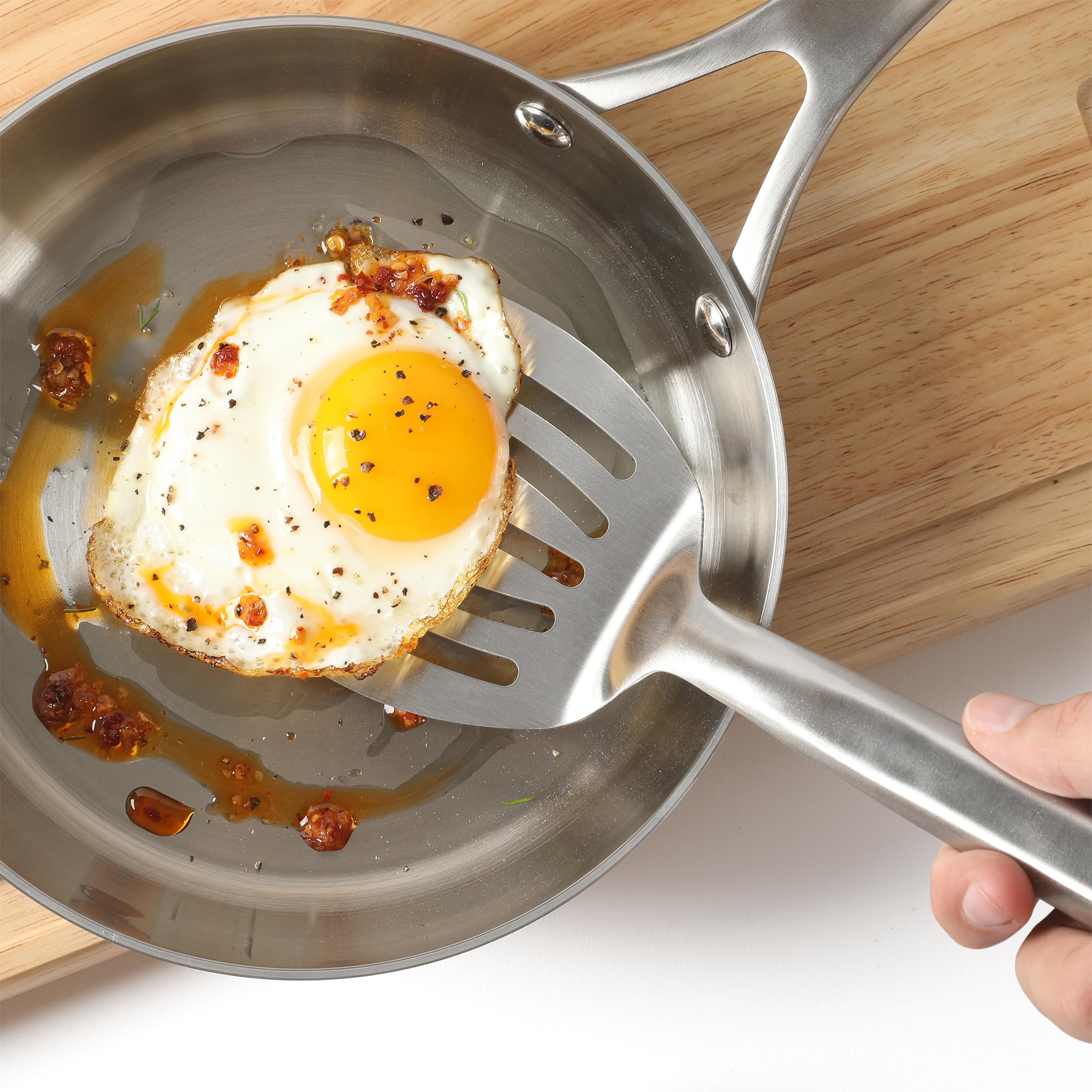 Calphalon Prime slotted turner ready for flipping and serving meals.