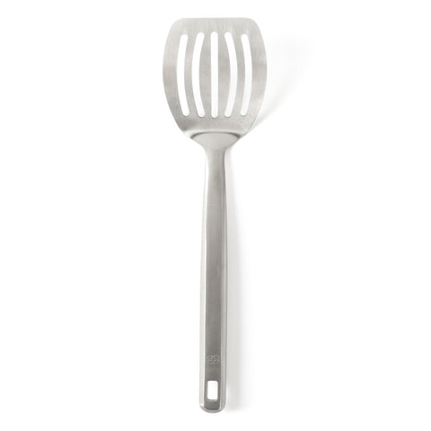 Calphalon Prime slotted turner blade enabling precise flipping with drainage.