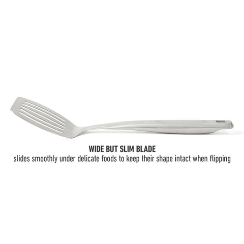 Calphalon Prime slotted turner in pan for efficient lifting.