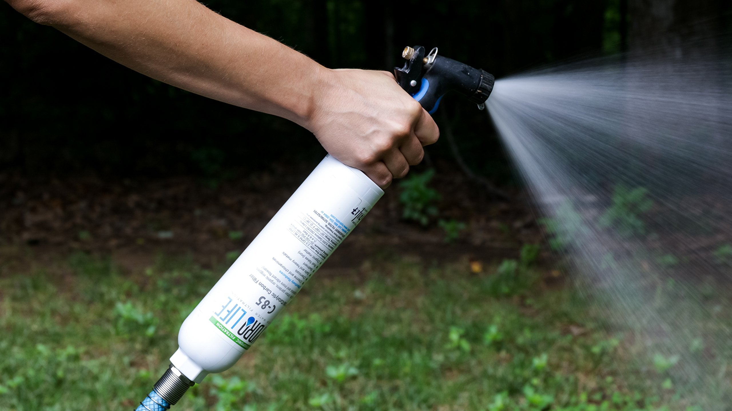 Flexible hose protector attached to Camco filter reducing faucet strain