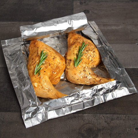Camerons Mesquite Smoker Bags on oven rack for mess-free cooking.