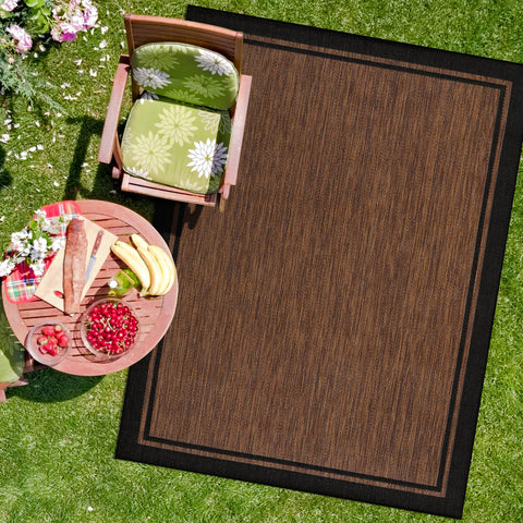 CAMILSON indoor outdoor rug in bordered nut brown black, ideal for patios and kitchens.