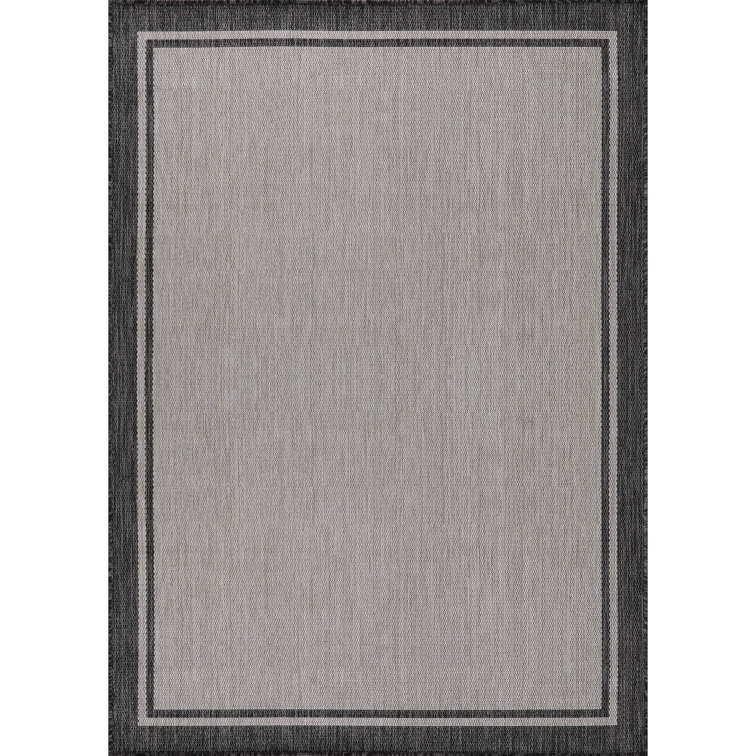 CAMILSON indoor outdoor rug on patio showing grey tones for versatile décor