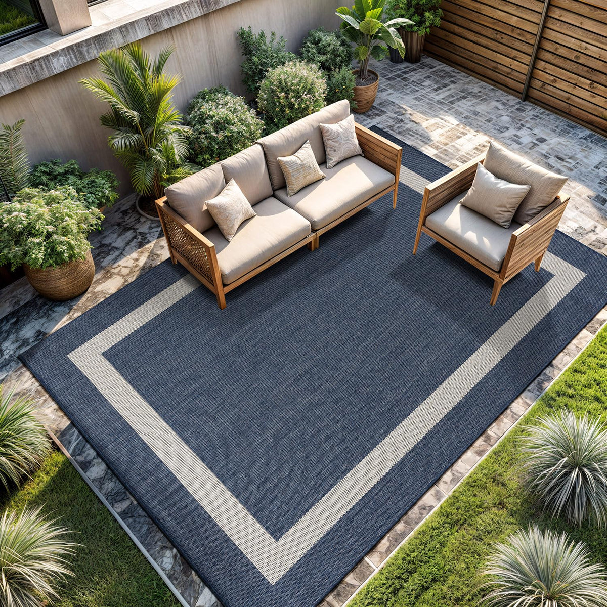 CAMILSON outdoor rug 6x9 with blue border for patios and porches.