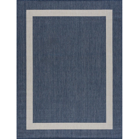 CAMILSON 8x10 border rug on a deck, UV-protected and weather-ready for outdoors.