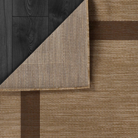 CAMILSON outdoor rug 9x12 on garden path emphasizes UV protection for sunny spaces.