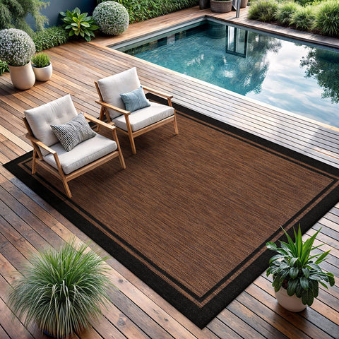 CAMILSON stain-resistant bordered rug helps resist dirt in high-traffic zones.
