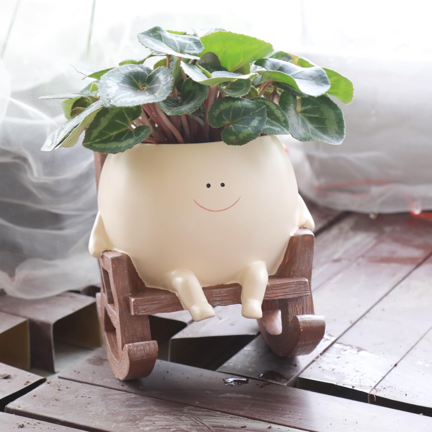 Camotank smiley-face rocking planter close-up for playful indoor decor