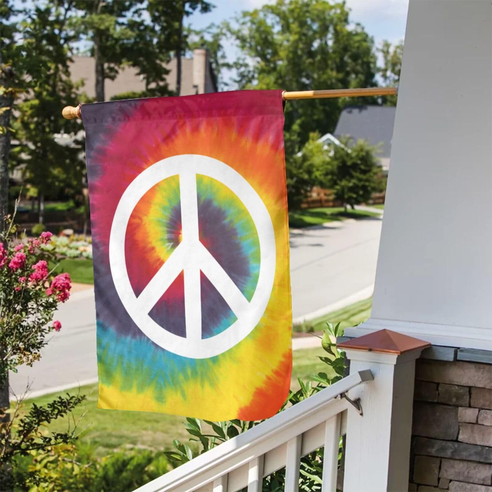Caqqweiz Tie Dye Peace Flag garden flag beside porch for welcoming charm.