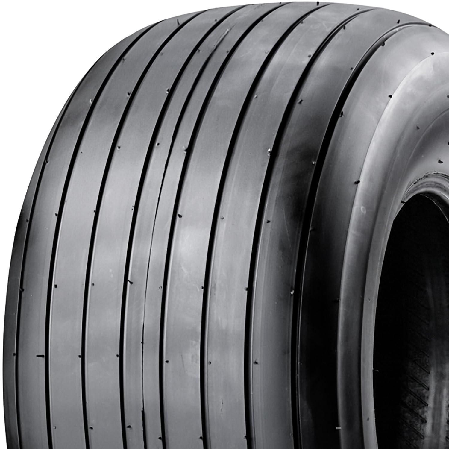Carlisle Straight Rib Tire traction-contact image illustrating grip on dirt and grass