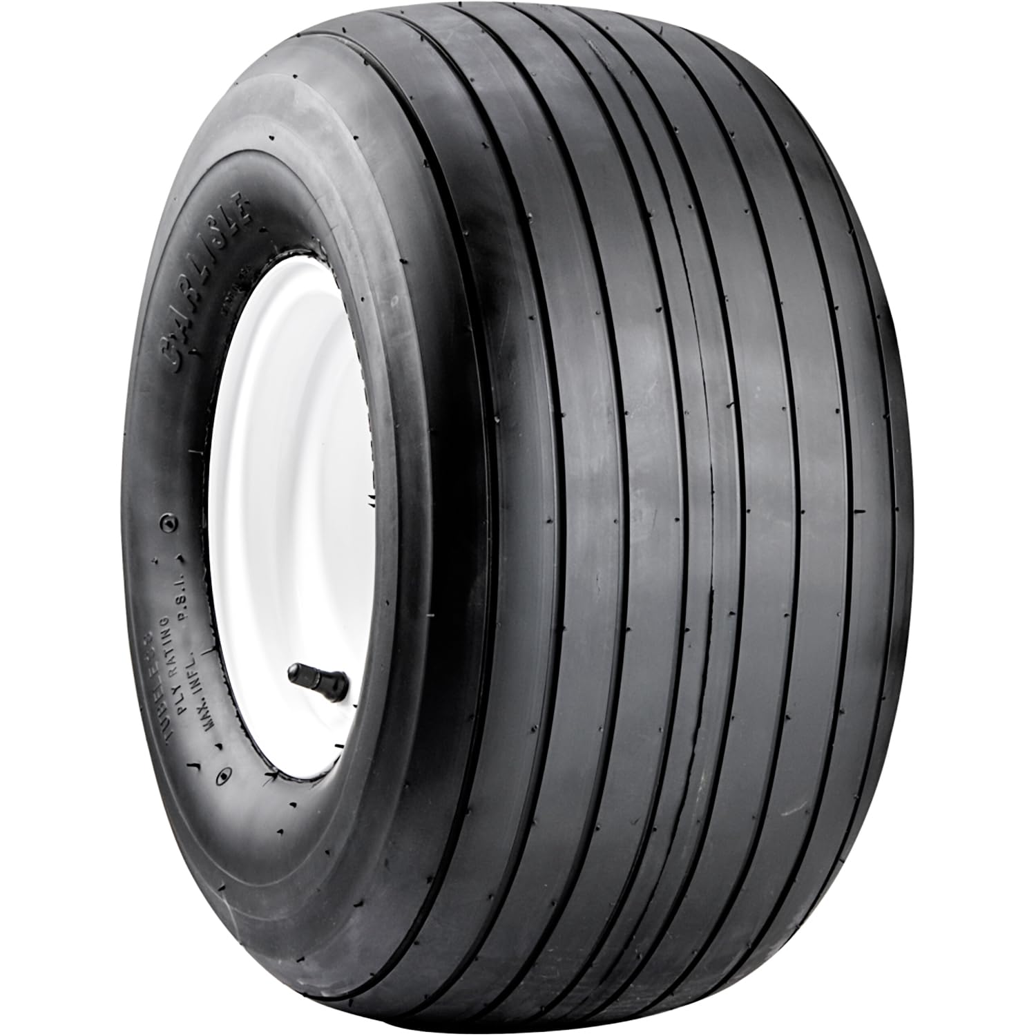 Carlisle Straight Rib Tire mud-and-grass image demonstrating smooth roll on uneven terrain