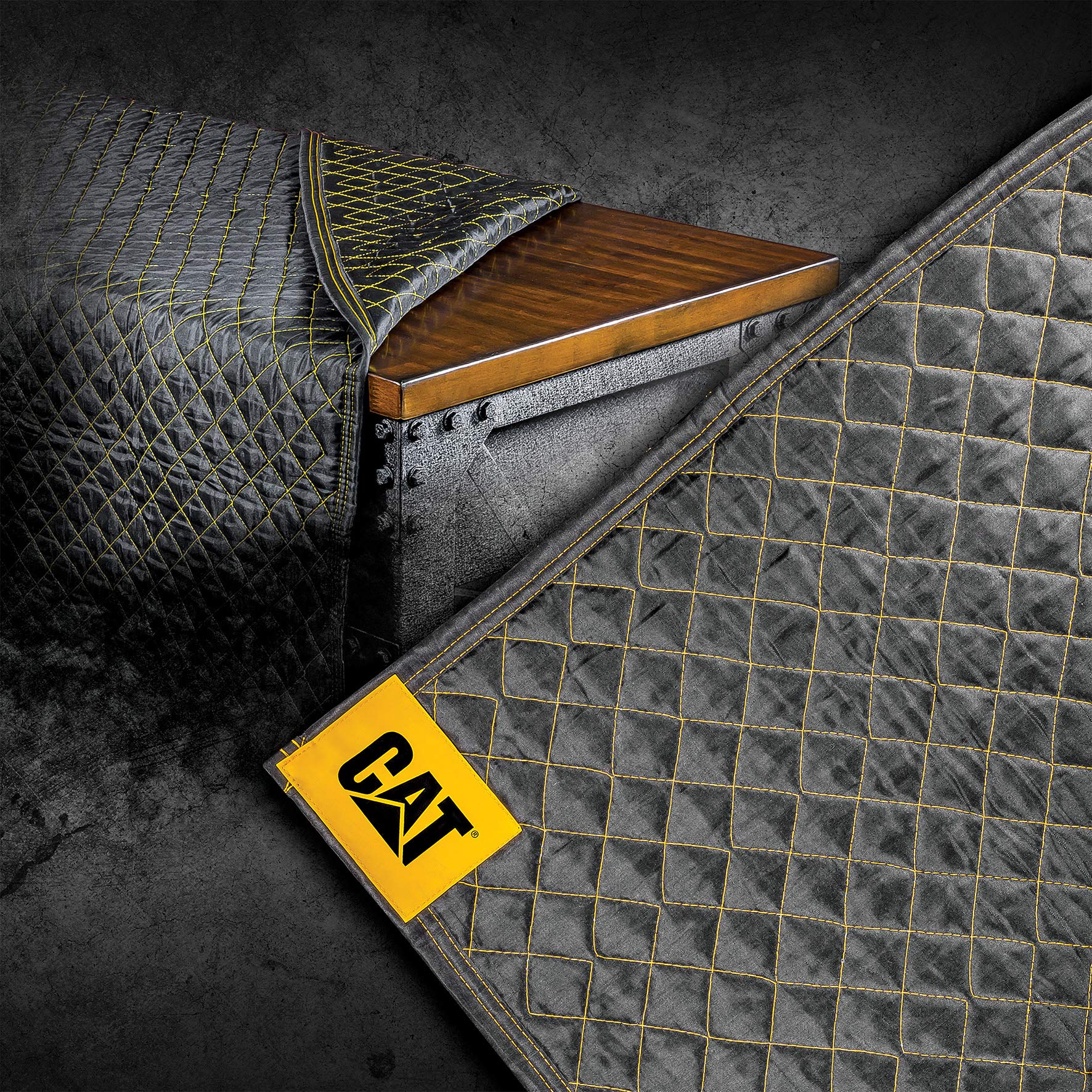CAT Utility Padded Moving Blanket texture close-up showing heavy-duty polyester for lasting use.