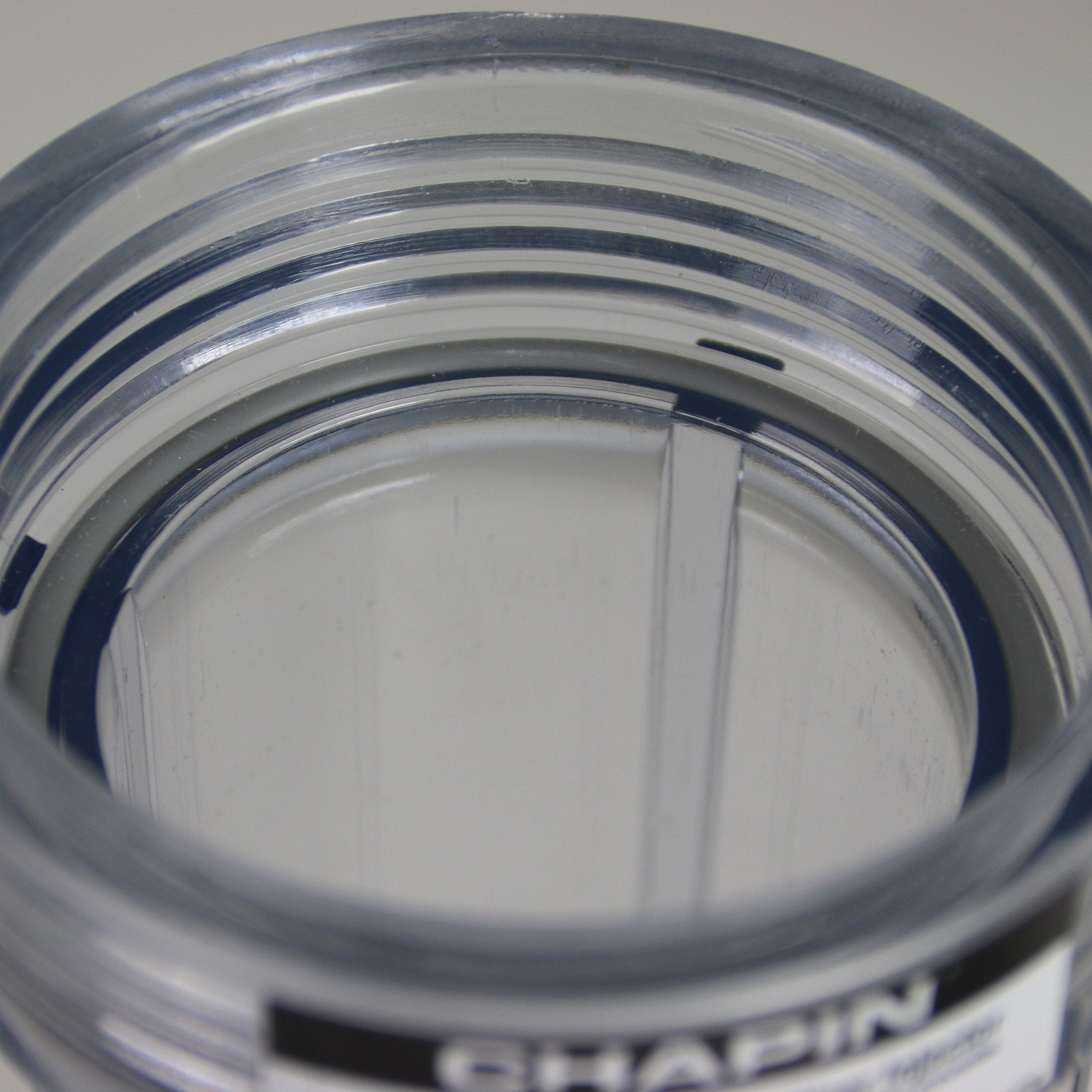 Chapin HydroFeed bracket-mount demonstrates secure outdoor installation beside a spigot.