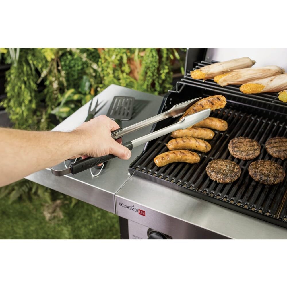 Char-Broil Aspire grill fork in action for precise hot items handling.