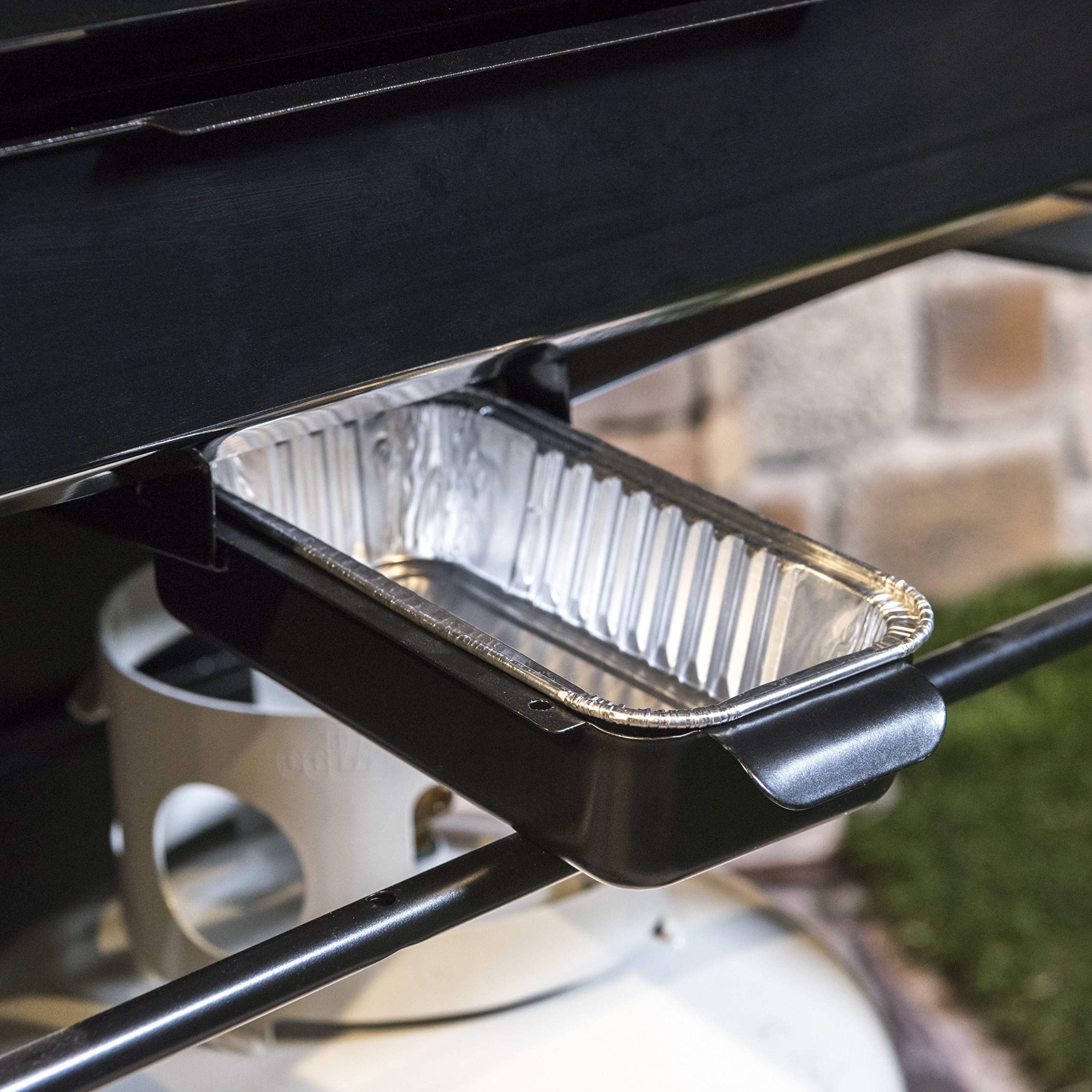 Close-up of Charbroil drip pans in a grease tray for mess-free cooking.