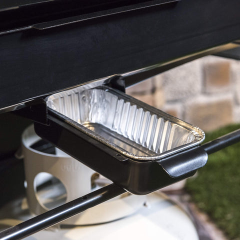 Close-up of Charbroil drip pans in a grease tray for mess-free cooking.
