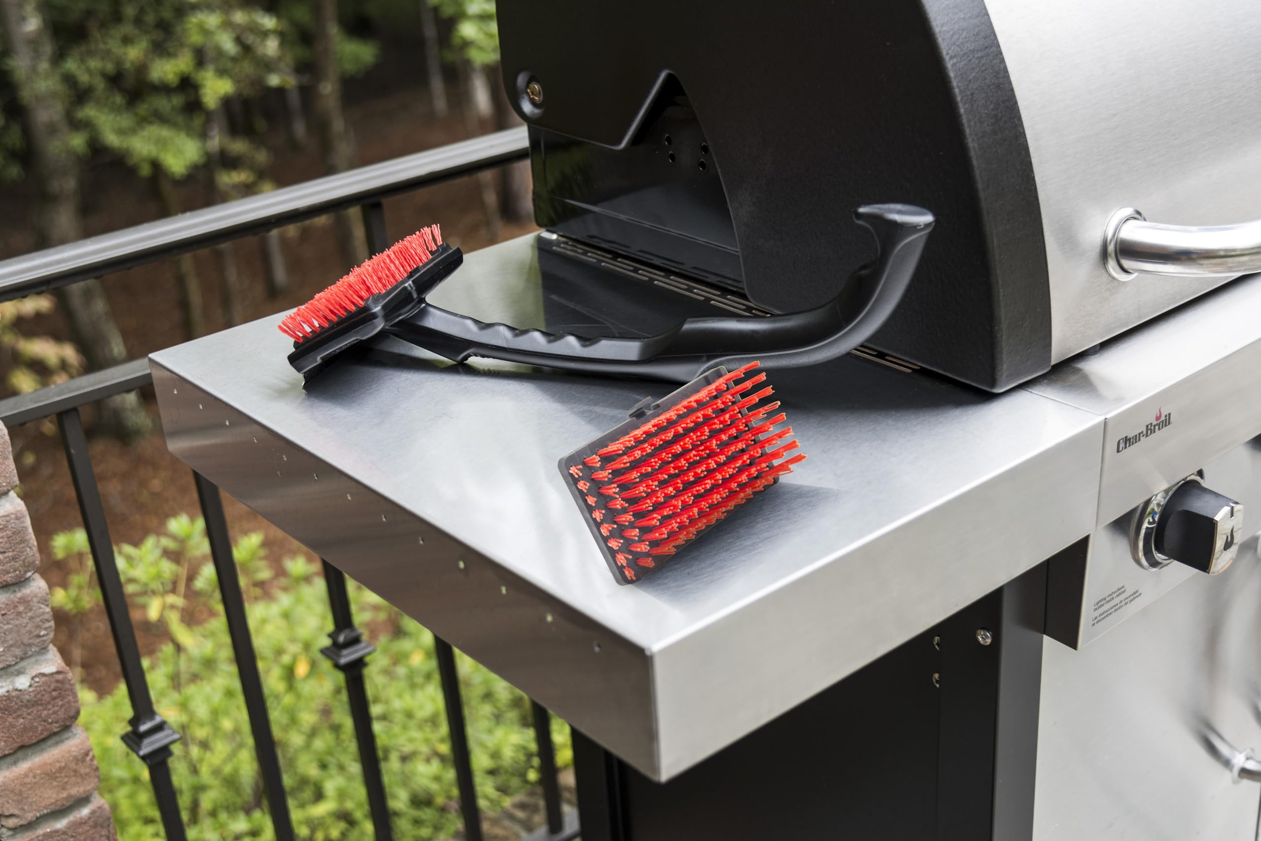 Charbroil Cool-Clean Brush XL on a grill grate demonstrating effective cleaning.