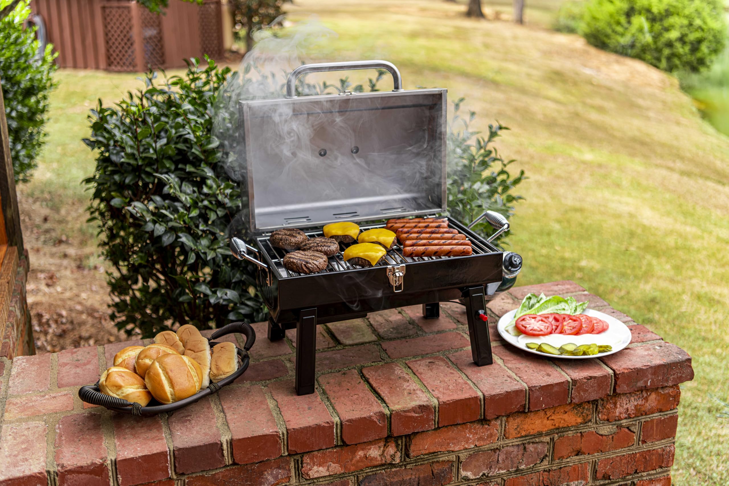 Charbroil piezo electric igniter lights with a push of a button.