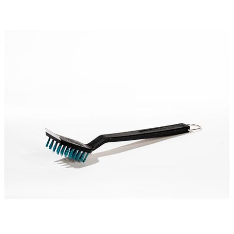 Charbroil Safer Grill Brush hung on hook for quick, organized storage.
