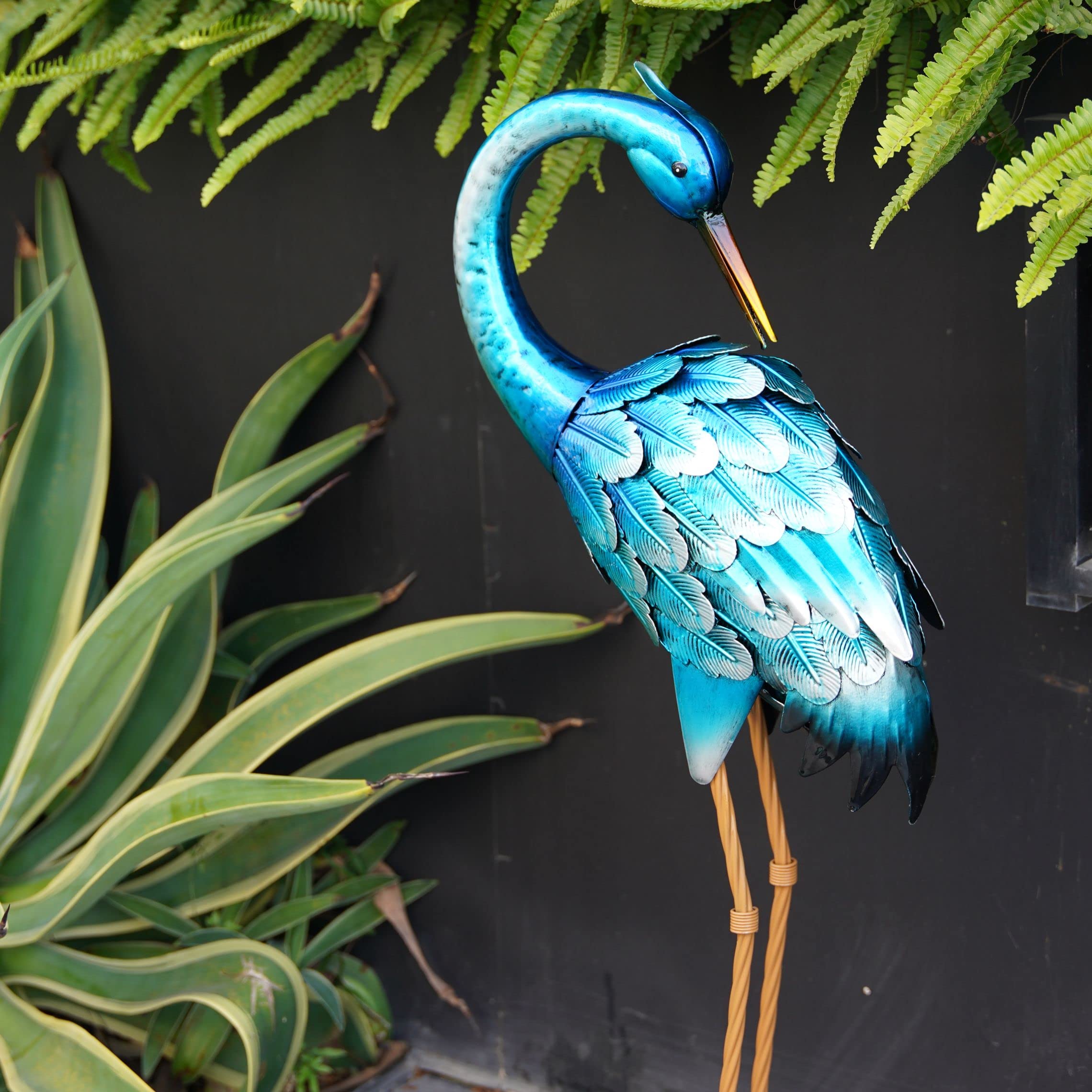 Chisheen backyard pond crane sculpture enhances outdoor landscape with color.