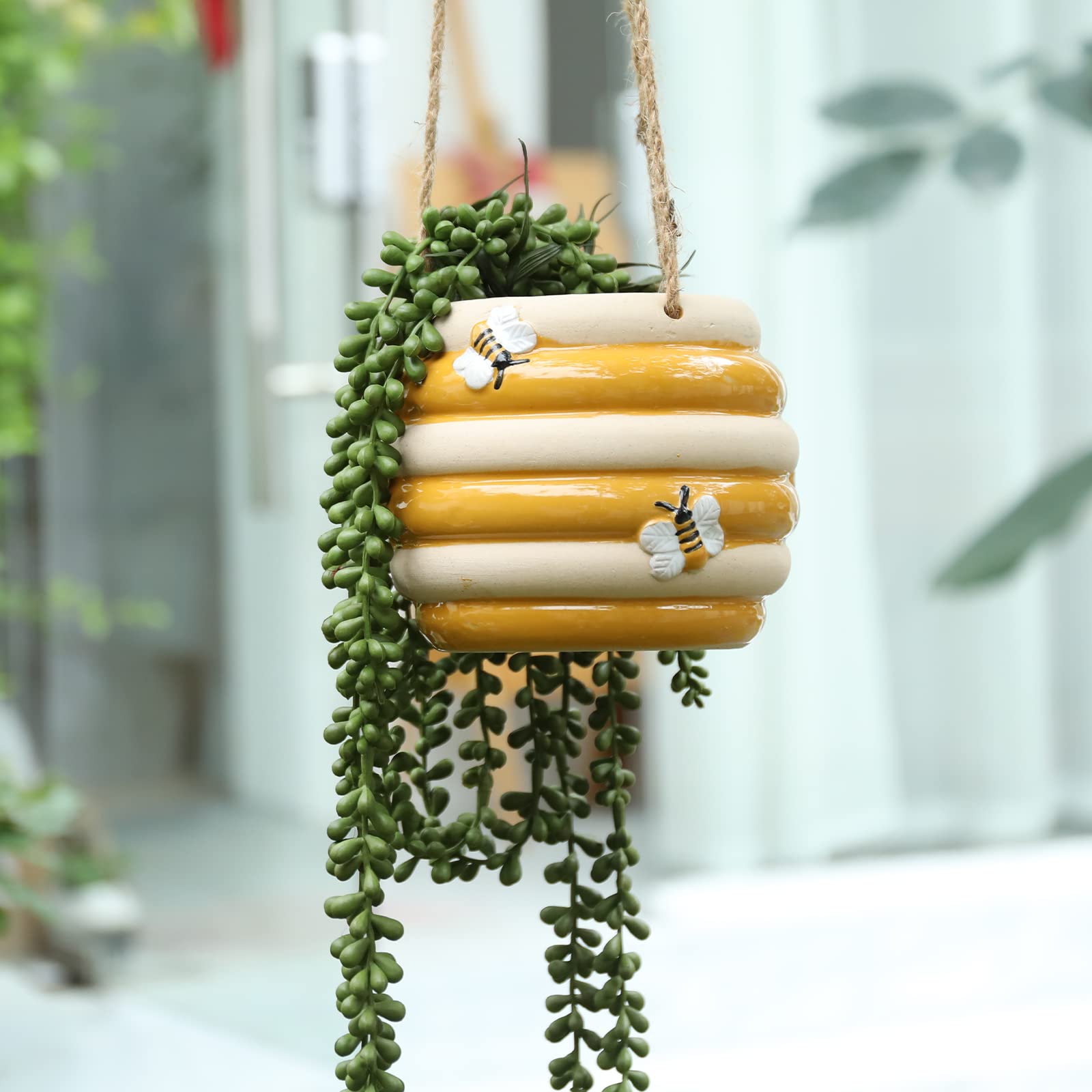 Chonsun hanging ceramic planter with yellow bee pattern brightens a sunny balcony