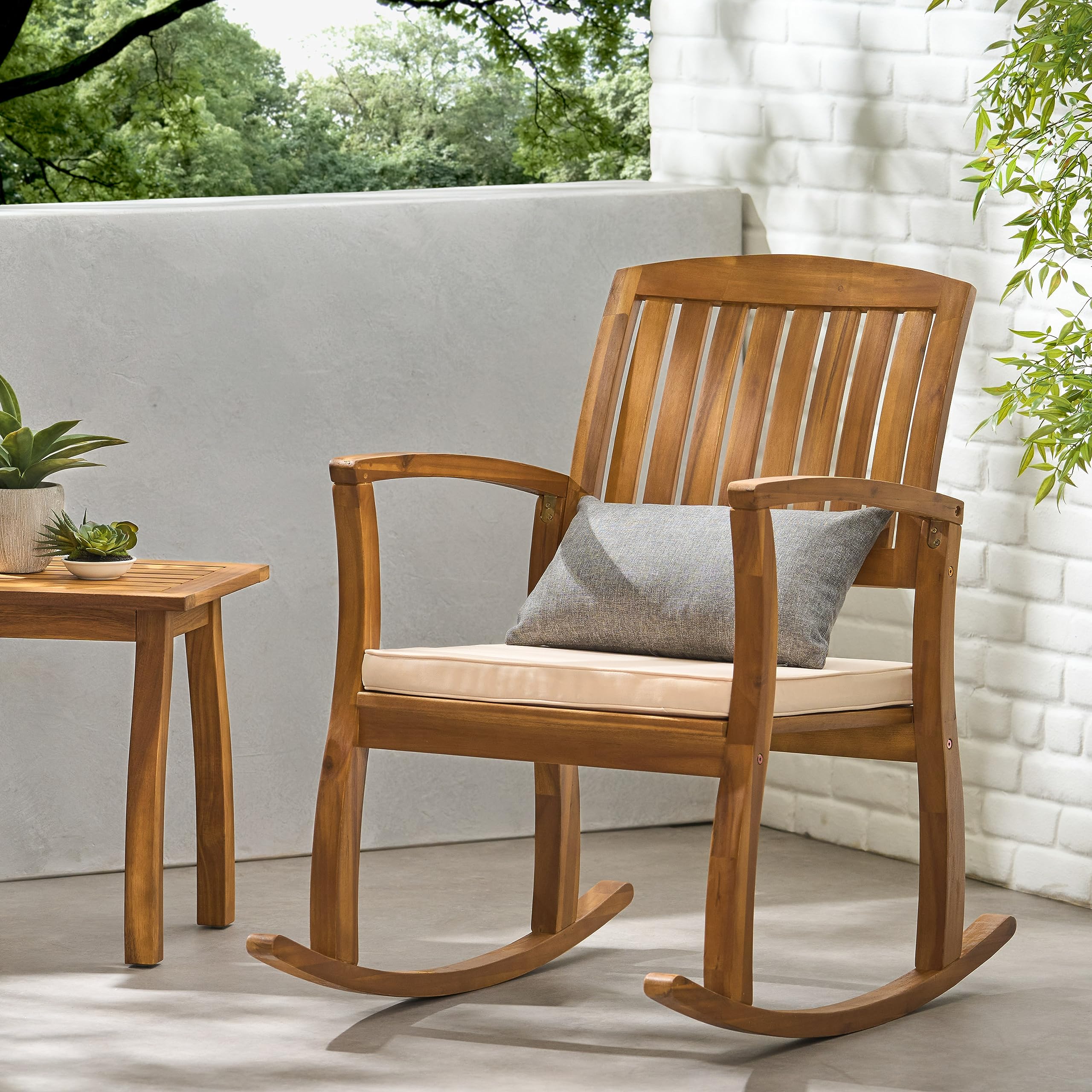 Selma chair backrest slats highlight a refined outdoor design for porch spaces