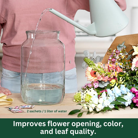 Chrysal flower food packets dissolving in water to feed blooms.