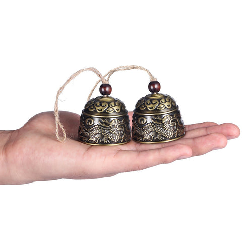 Chuangdi fish and cloud motif bell enhances indoor Feng Shui decor.