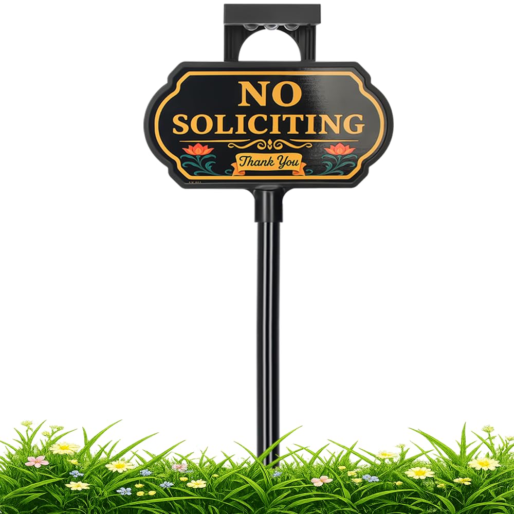 CKOK solar no-soliciting sign with floral panel lights after dark for visibility.