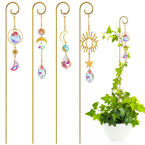 CKUJJUI crystal sun catcher plant stake with gold finish reflects sunlight on a windowsill.