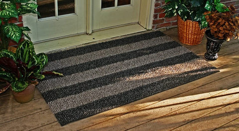 Close-up of dense blades on the Clean Machine doormat capturing dirt before entry