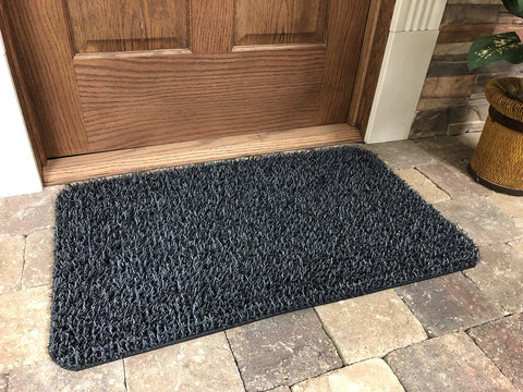 Closeup of scraper blades on Clean Machine Dirt Trapper Doormat capturing dirt