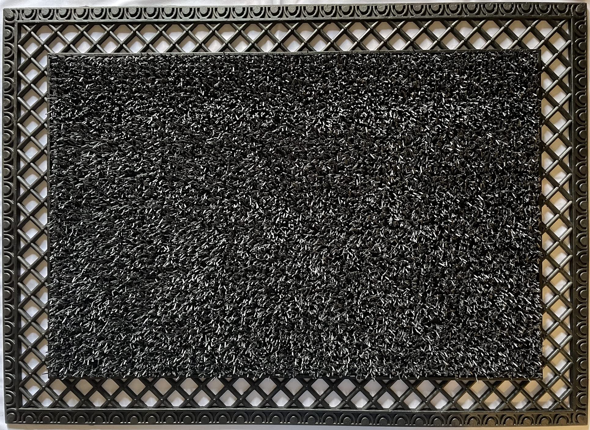 Clean Machine French Quarter Astro Turf Doormat traps dirt at the doorway.