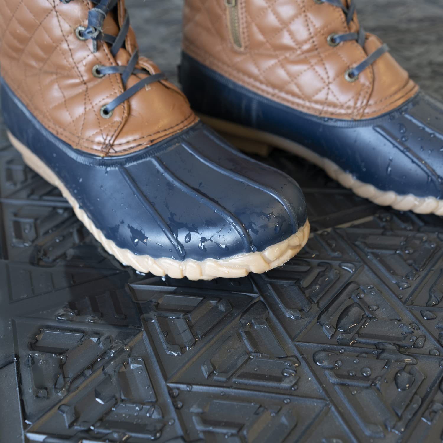 ClimaTex mat cleans shoes and paws with easy hose cleaning.