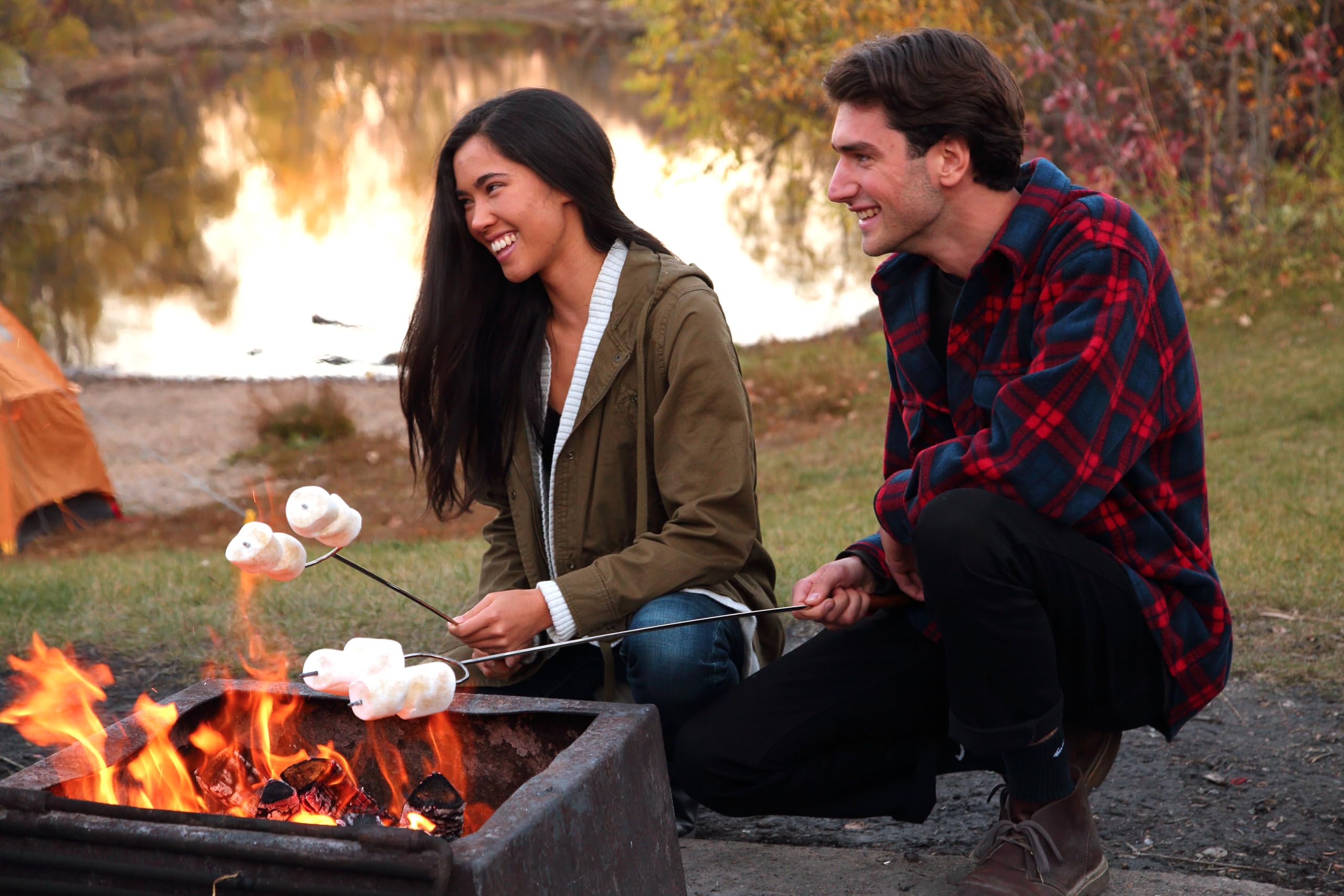 Coghlan's camp forks in action over a fire pit for marshmallows and hot dogs