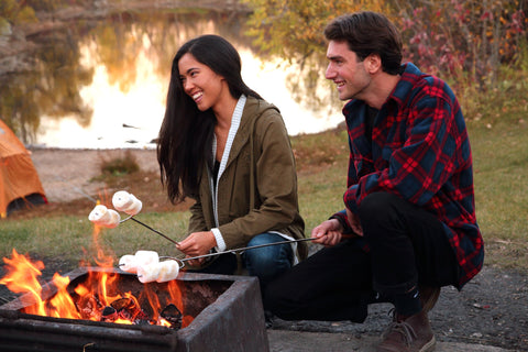 Coghlan's camp forks in action over a fire pit for marshmallows and hot dogs