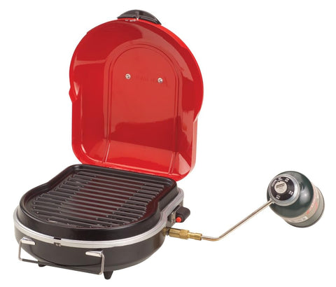 Coleman Fold N Go 6,000 BTU grill, compact folded form for easy transport.